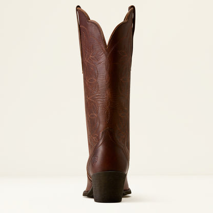 A single brown leather cowboy boot shown from the back, featuring decorative tooling and stitching on the shaft, set against a plain off-white background.