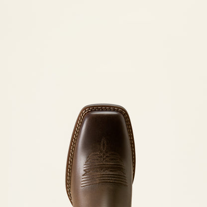 Close-up of the toe of a dark brown leather cowboy boot with decorative stitching, shown against a solid off-white background.