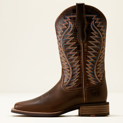 A single brown leather cowboy boot with decorative embroidered shaft, shown in side profile against a light cream background.
