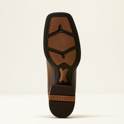 The outsole of a brown leather boot with a black rubber tread, featuring the brand name ARIAT embossed on the heel.