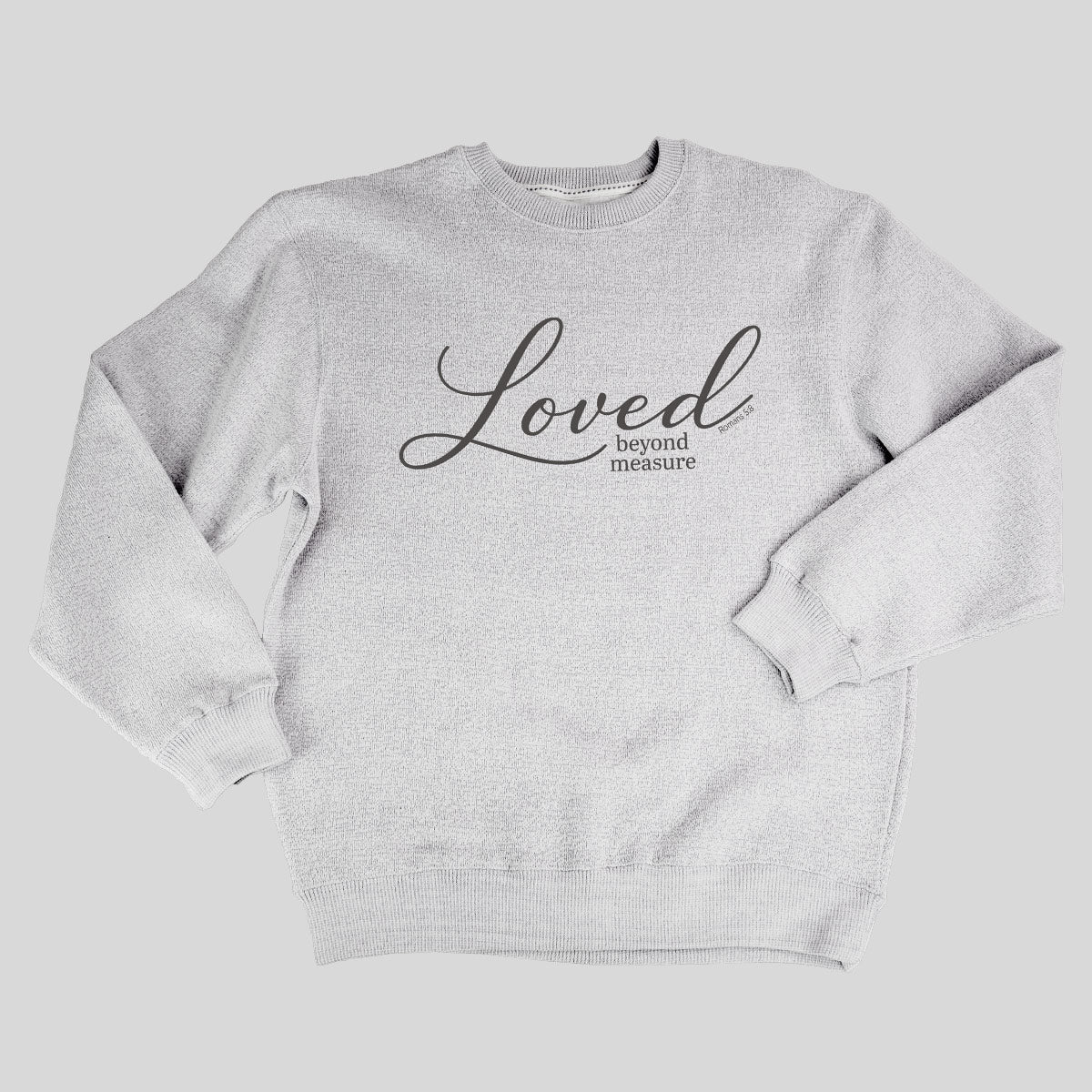 A light heather gray crewneck sweatshirt from Grace & Truth featuring the text 'Loved beyond measure' printed in black across the chest, displayed flat against a solid gray background.