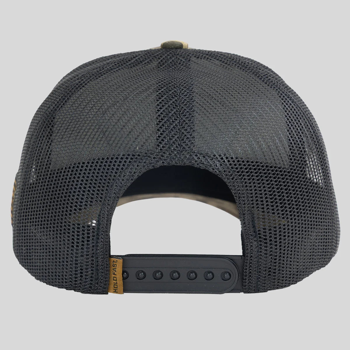 Rear view of a dark gray mesh trucker cap with a black snapback closure and a small tan brand tab reading Hold Fast