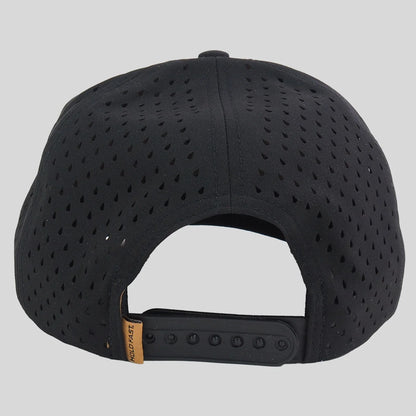 Black perforated snapback cap shown from the back, featuring a black adjustable strap with a small tan brand tab that reads 'HOLD FAST'.