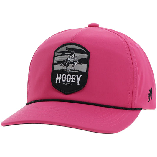 a pink hooey cap with black accents and a patch with a bucking horse that says 'hooey'