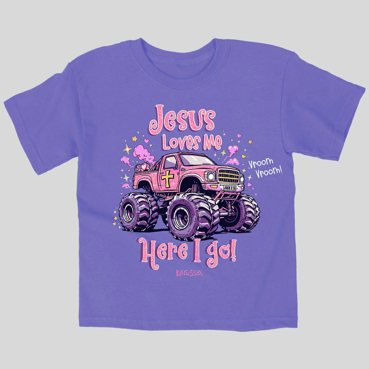 A purple short-sleeve t-shirt from Kerusso with a graphic of a pink monster truck and the text 'Jesus Loves Me Here I go!' on a light gray background.