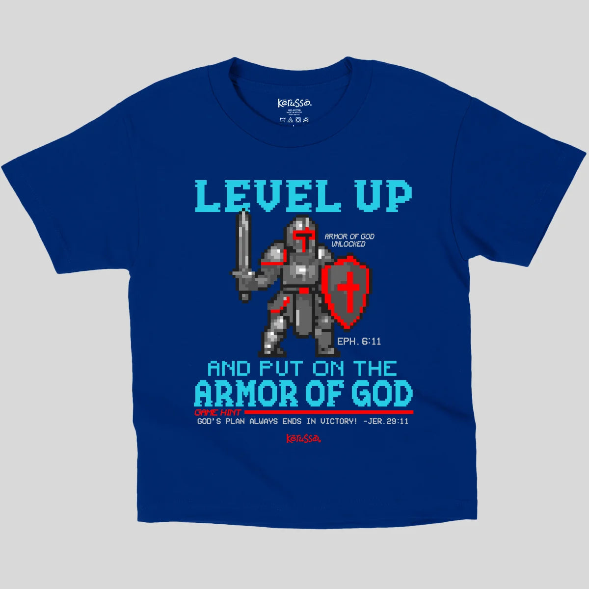 A royal blue short-sleeve t-shirt from Kerusso with a graphic print of a pixel-art knight in red and gray armor holding a sword and shield. The text reads 'LEVEL UP AND PUT ON THE ARMOR OF GOD' with scripture references.