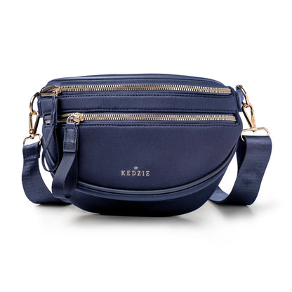 Blue crossbody bag by Kedzie on a white background