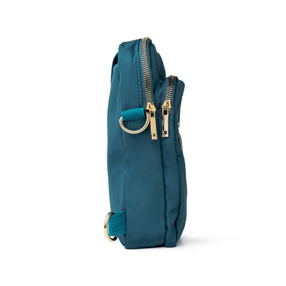 Teal Kedzie crossbody bag with gold zippers on a white background