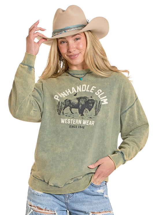 Woman wearing a green 'Panhandle Slim' western wear sweatshirt with a cowboy hat on a white background