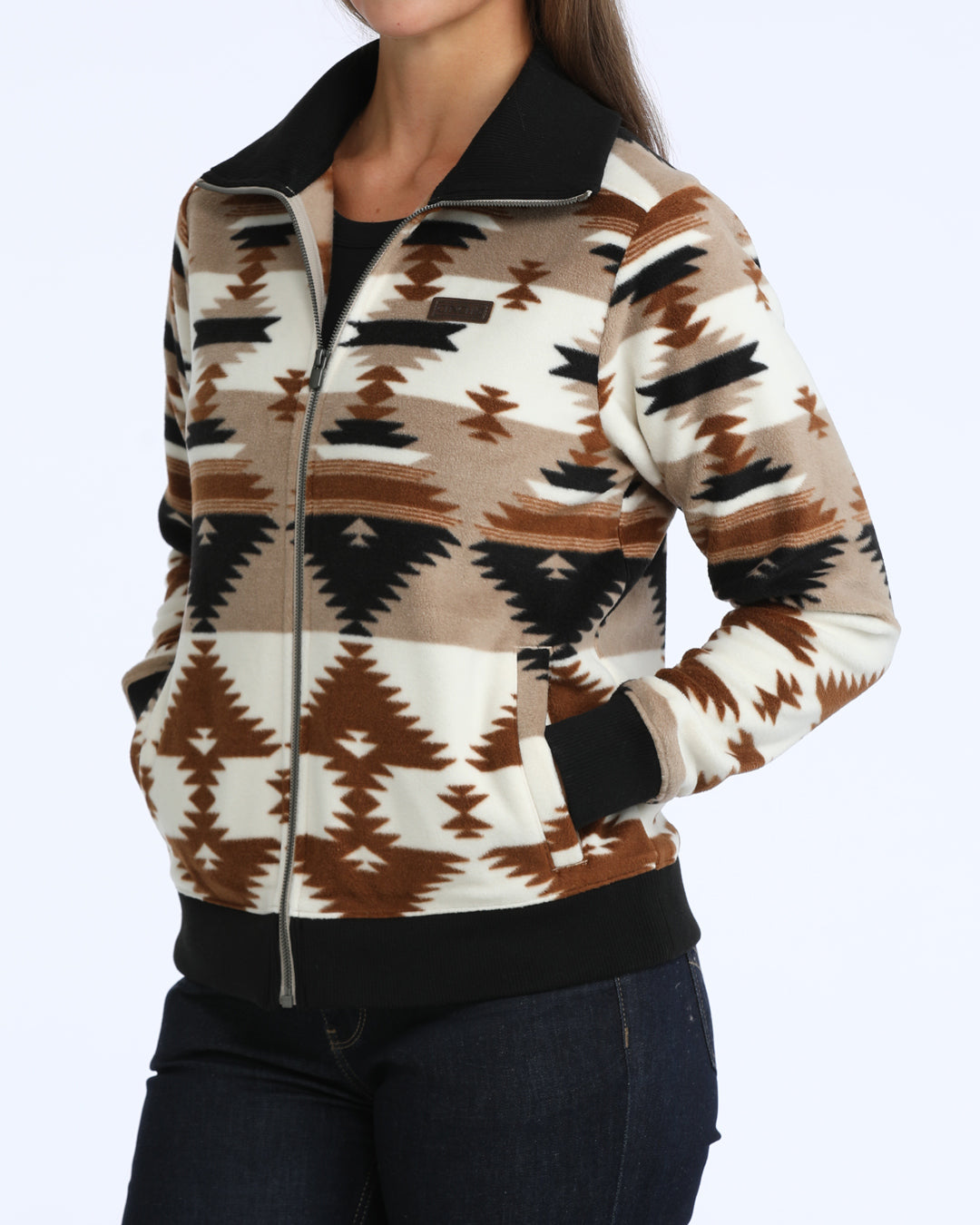 woman wearing an aztec fleece sweater from Cinch on a white background