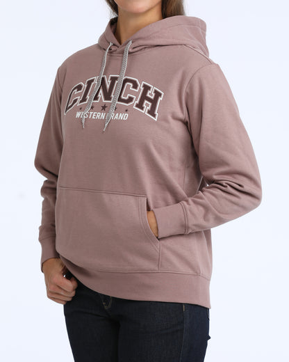 Person wearing a brown hoodie with 'Cinch' logo on a white background