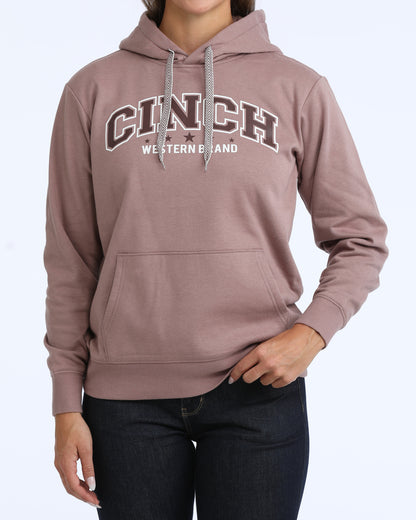 Person wearing a brown hoodie with 'Cinch Western Wear' logo on a white background