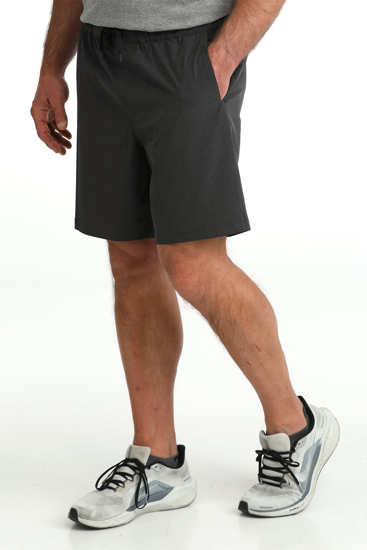 man wearing Cinch Athletic shorts on a white background