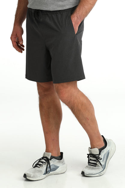 man wearing Cinch Athletic shorts on a white background