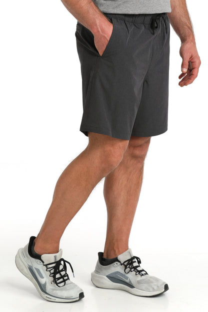 man wearing Cinch Athletic shorts on a white background