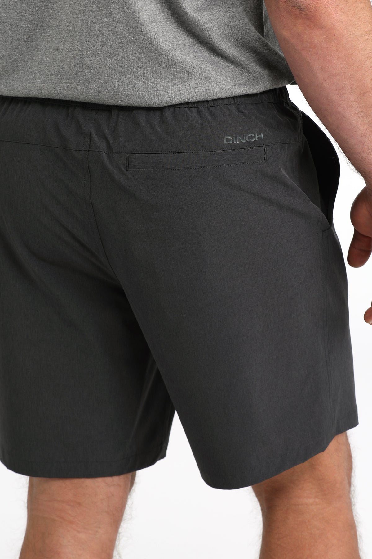 man wearing Cinch Athletic shorts on a white background