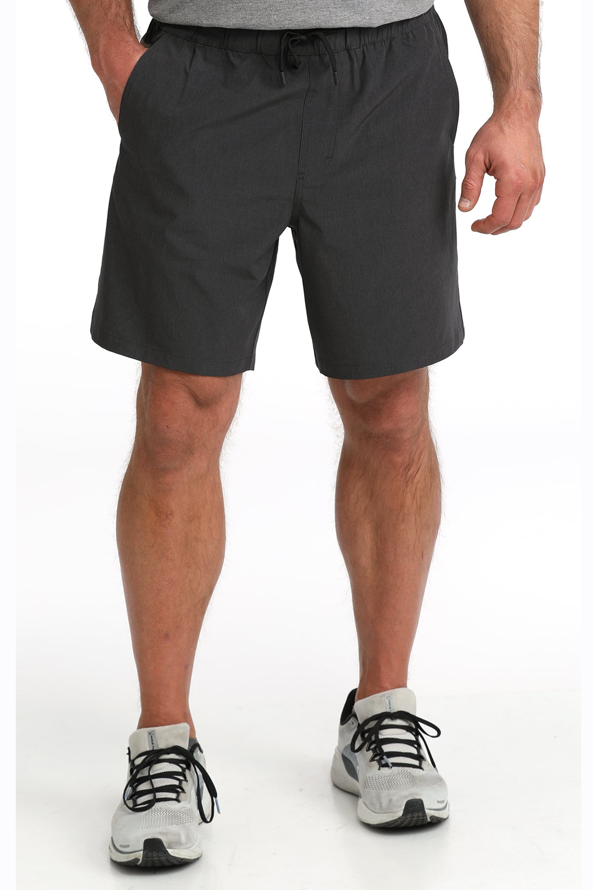 man wearing Cinch Athletic shorts on a white background