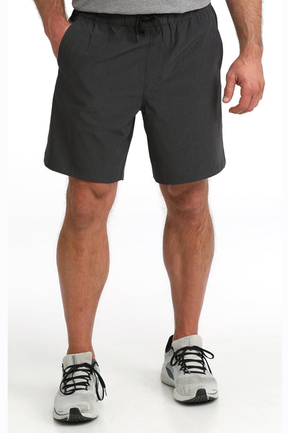 man wearing Cinch Athletic shorts on a white background