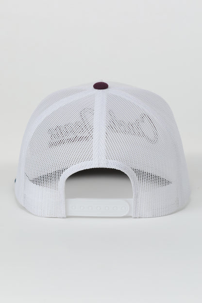 White mesh Cinch cap with a red button on a light gray background