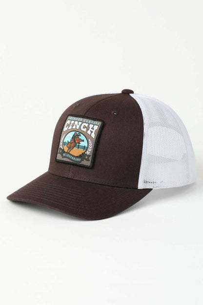 Brown and white 'Cinch' cap with a patch on a light gray background