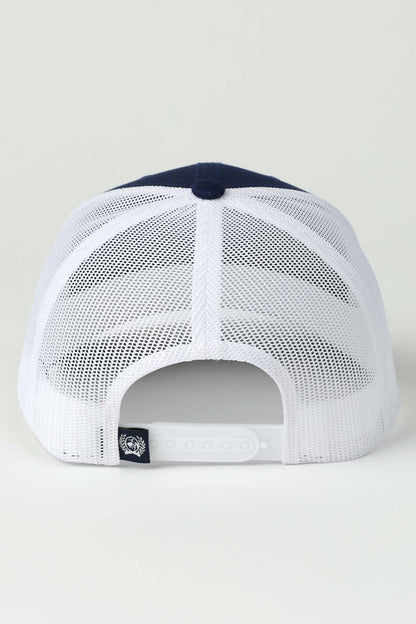 White mesh cap with navy blue visor on a light gray background