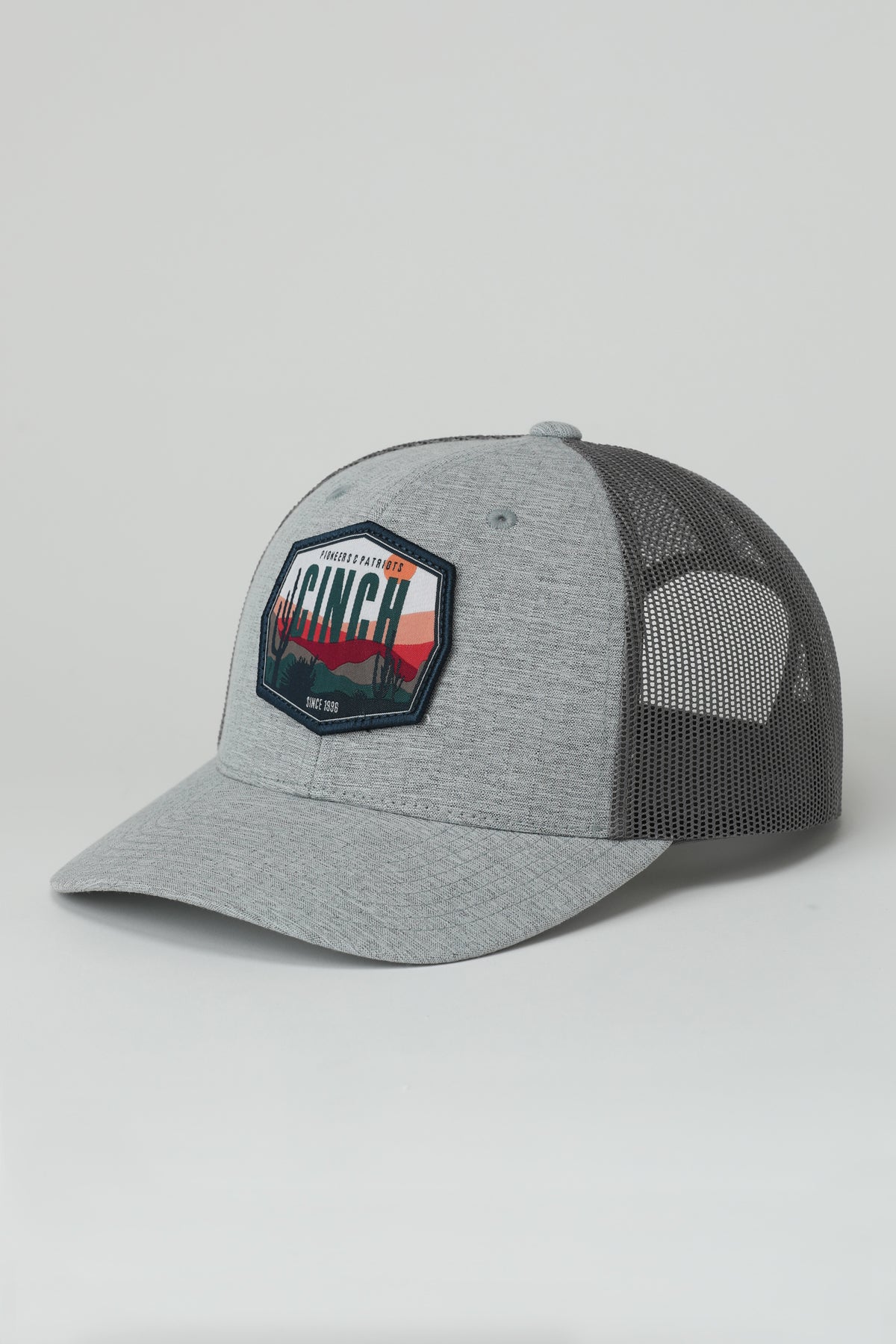 Gray and black mesh cap with a Cinch logo on a light gray background