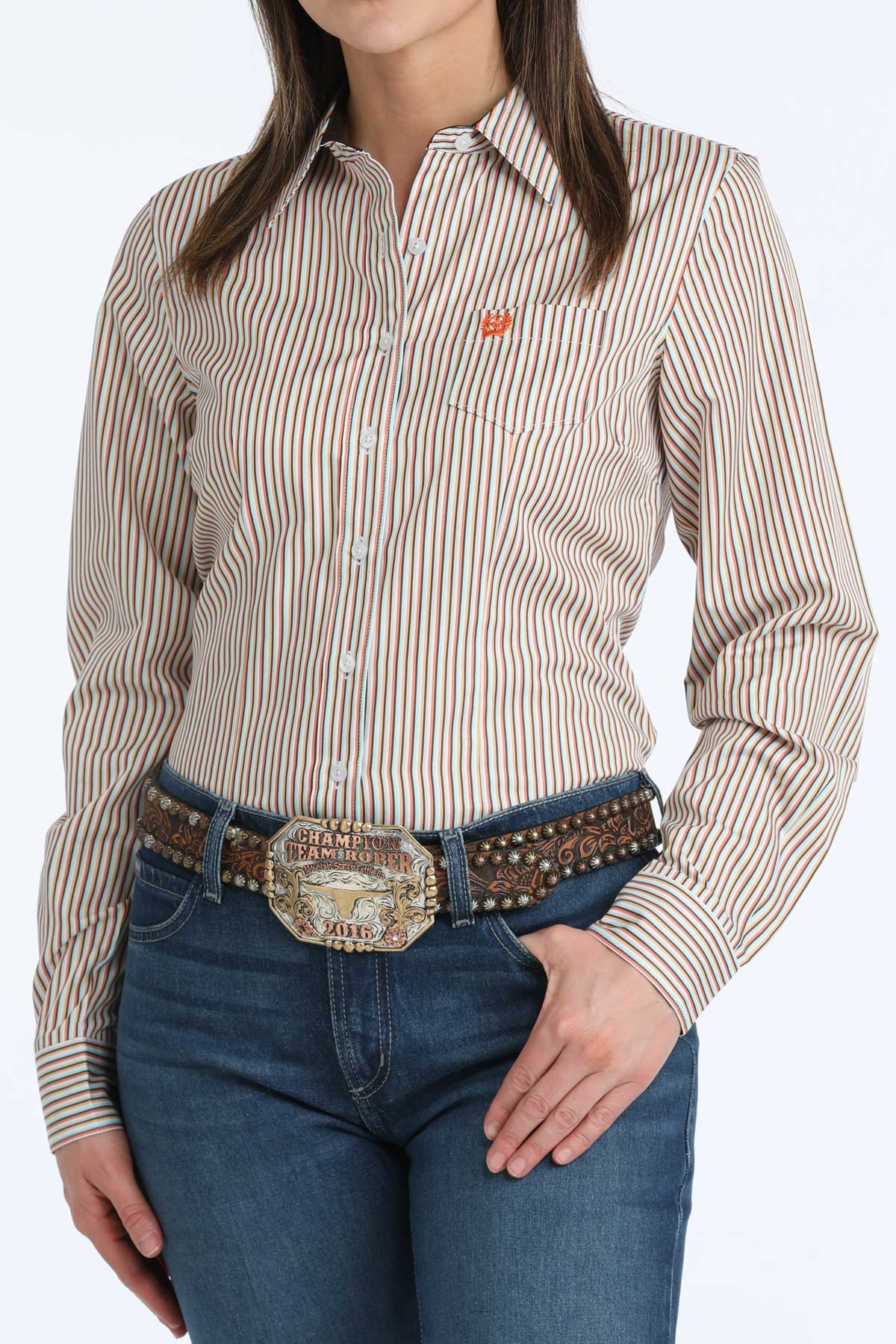Woman wearing a striped 'Cinch' shirt and jeans with a belt on a white background
