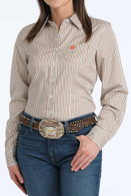 Woman wearing a striped 'Cinch' shirt and jeans with a belt on a white background