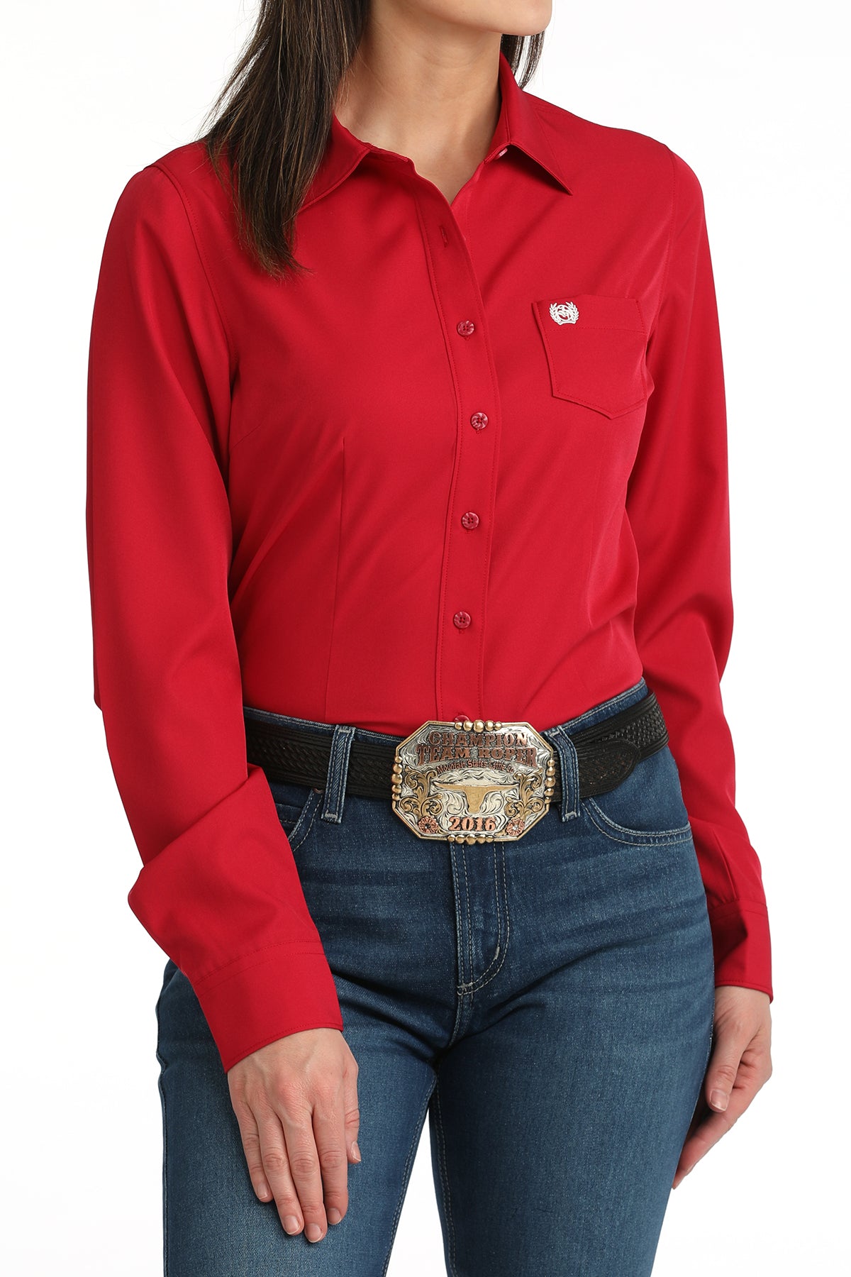 Pink cinch shirt worn by a woman on a white background