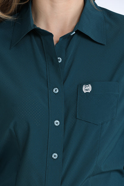 Close-up of a dark green Cinch shirt with a collar and button details.