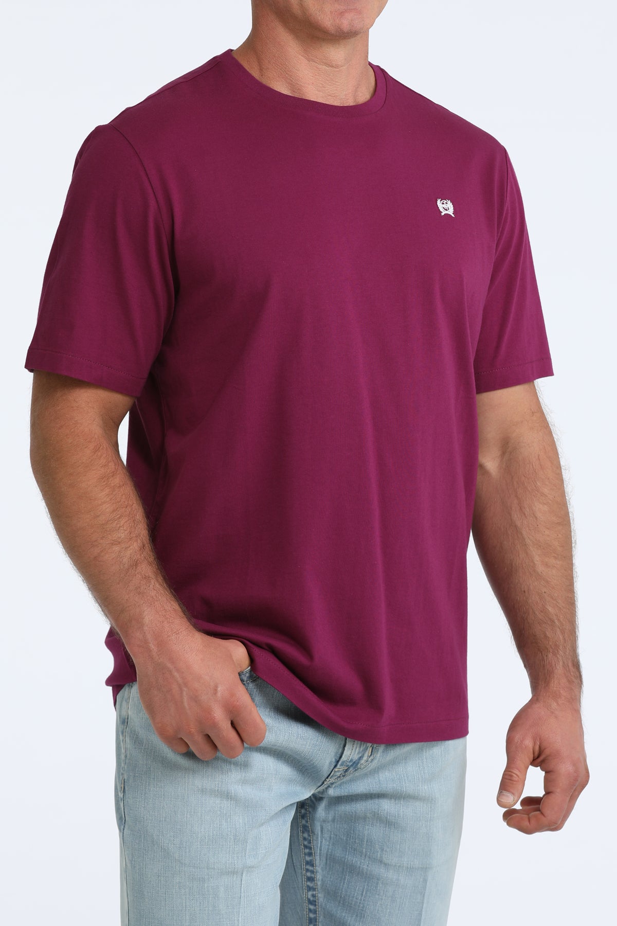 Person wearing a maroon CInch t-shirt with a small logo on a white background