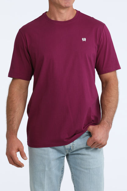 Person wearing a maroon CInch t-shirt with a small logo on a white background