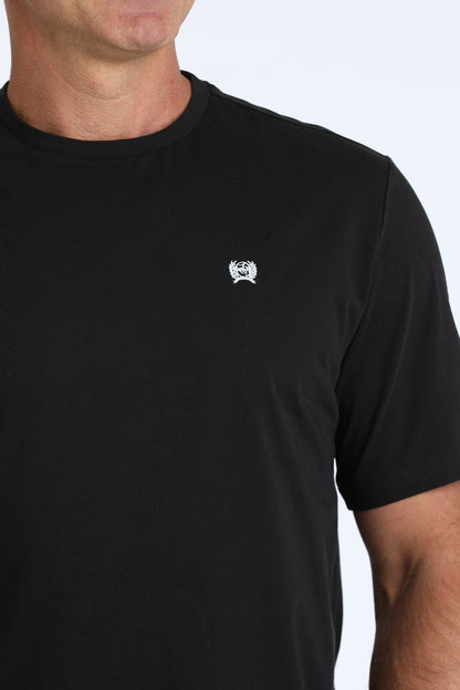 man wearing a black Cinch t shirt on a white background