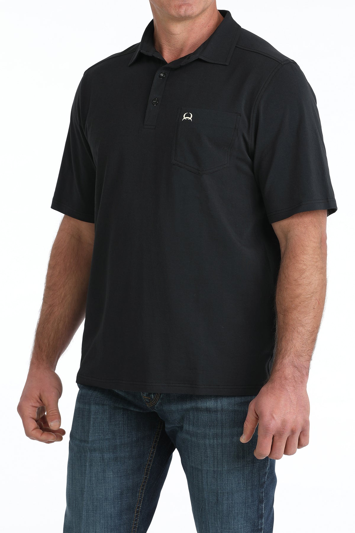 Man wearing a black polo shirt with a logo on a white background