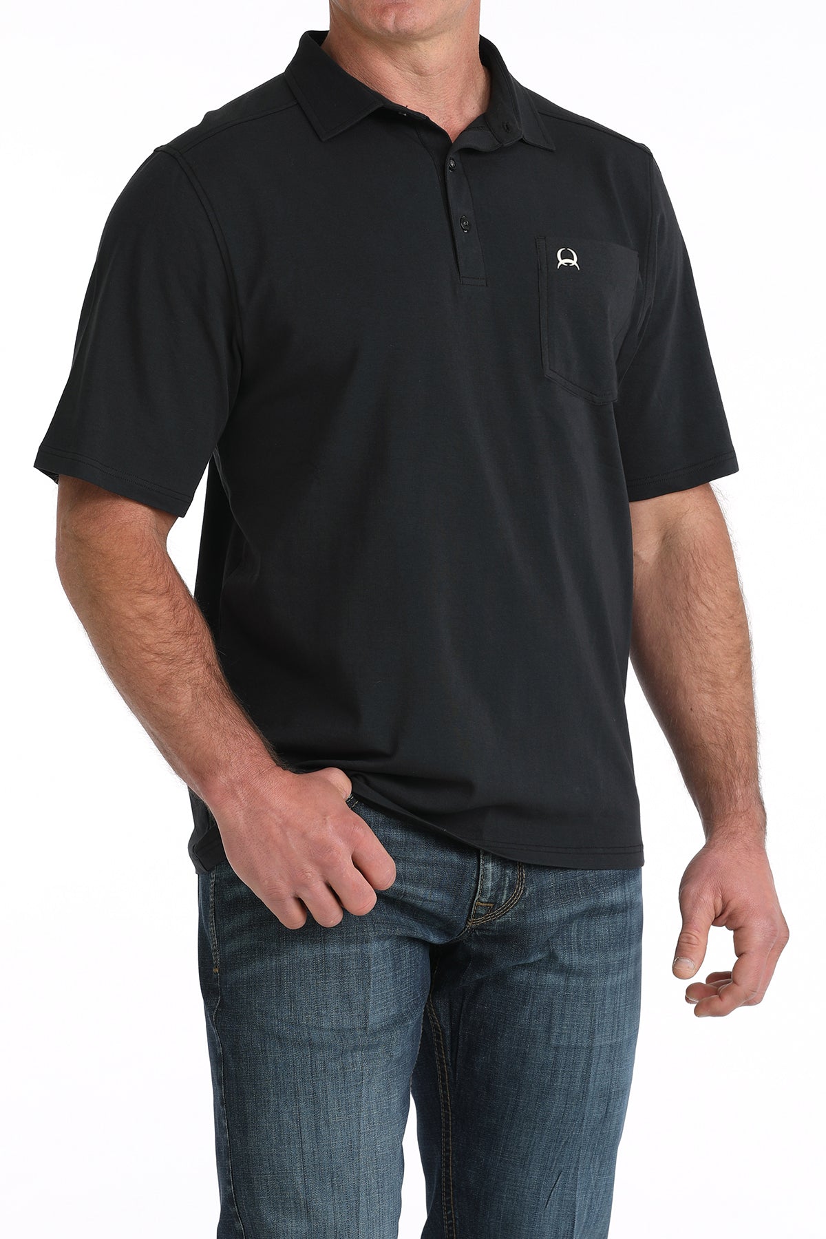Man wearing a black cinch polo shirt with a small logo on a white background
