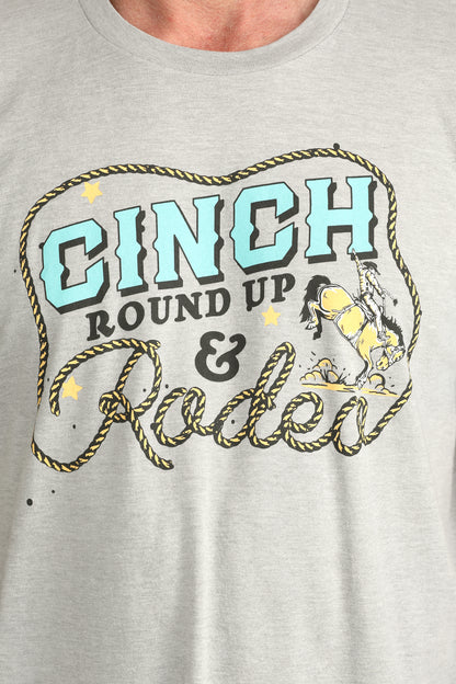 Gray t-shirt with 'Cinch Round Up & Rodeo' graphic design on a plain background