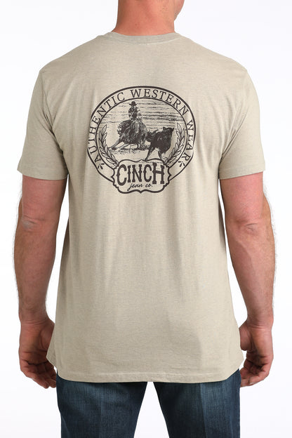 Beige Cinch t-shirt with a graphic design on a white background