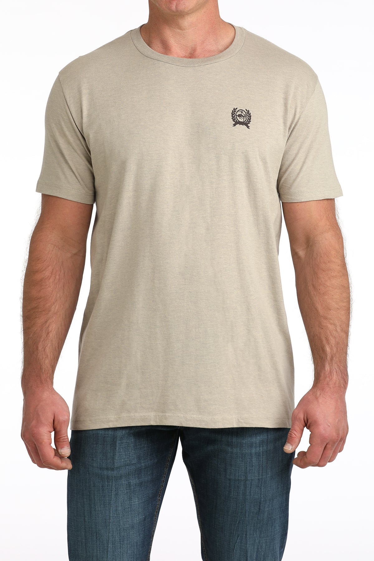 Man wearing a beige Cinch t-shirt with a small logo on a white background
