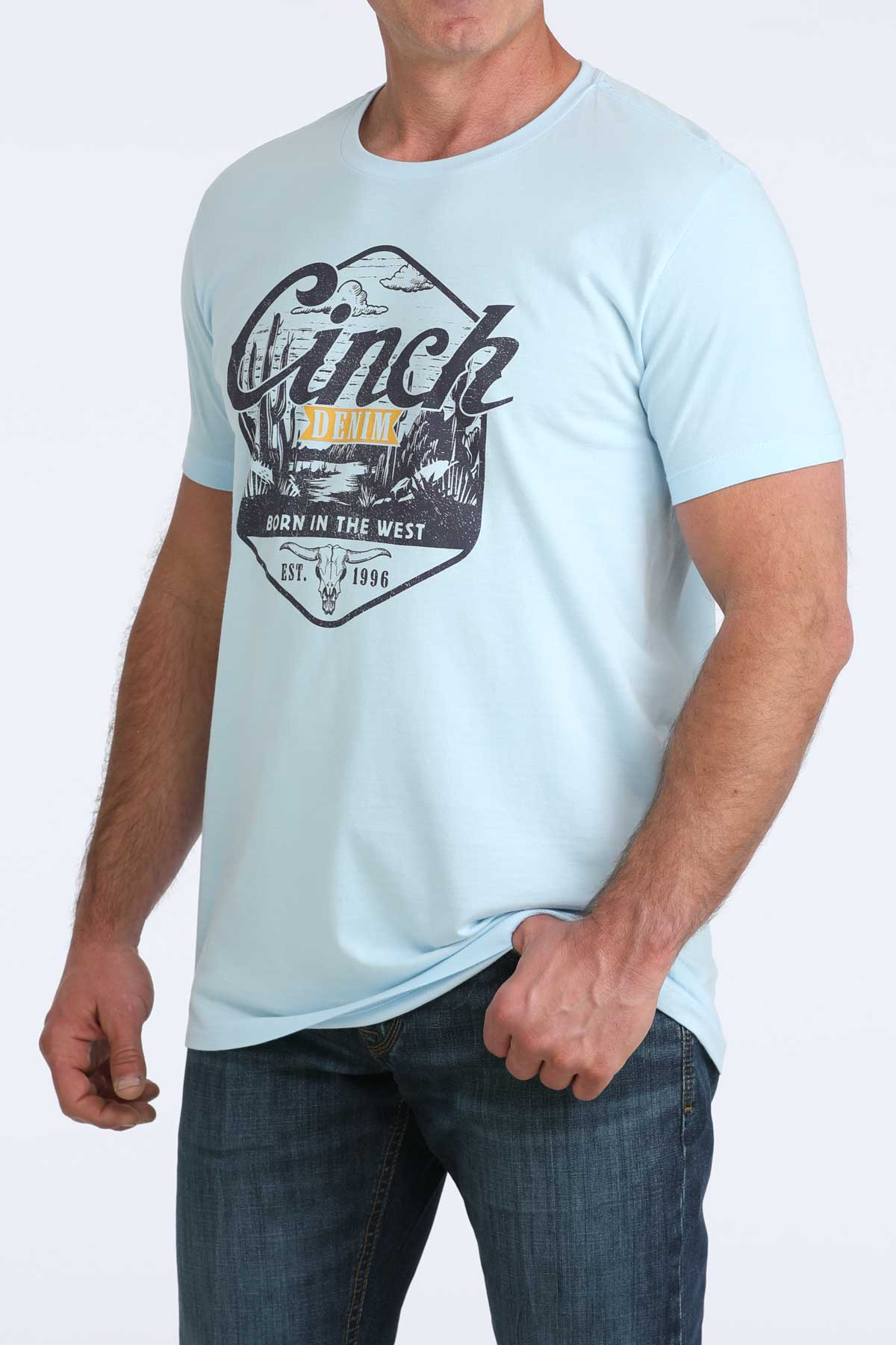 Light blue t-shirt with graphic design worn by a person on a white background