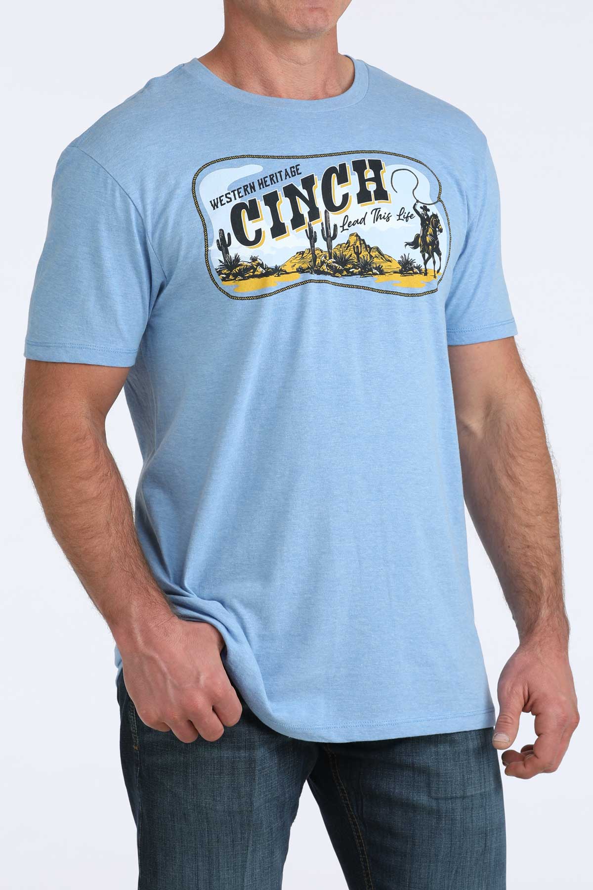 Light blue t-shirt with Cinch logo worn by a person on a white background