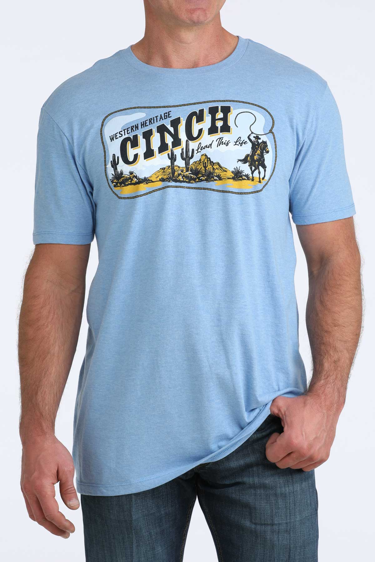 Light blue t-shirt with Cinch logo worn by a person on a white background