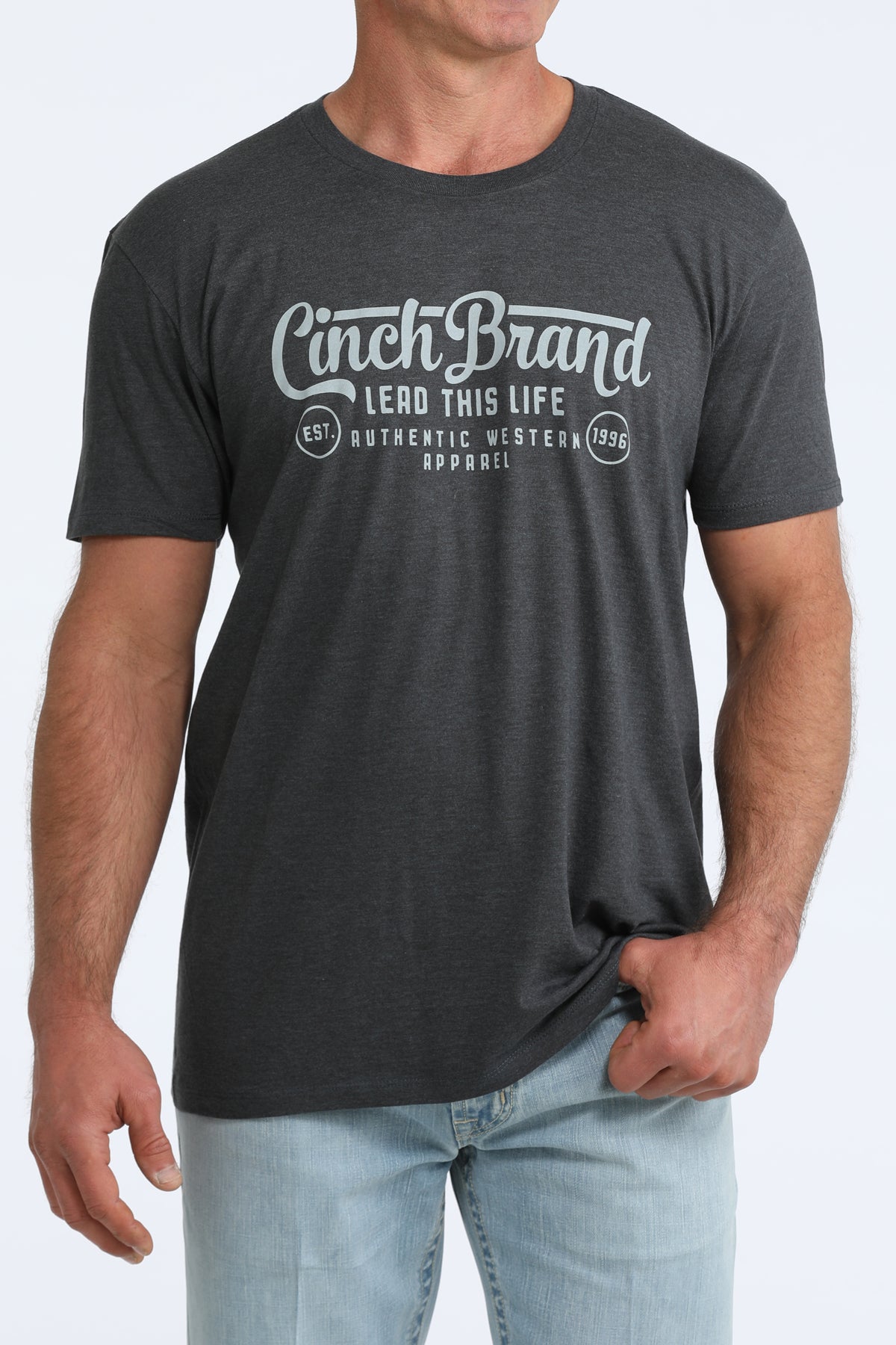 Person wearing a black t-shirt with 'Cinch Brand' logo and text on a white background