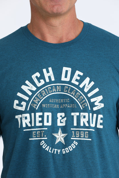 Blue t-shirt with 'Cinch Denim' text and logo on a plain background