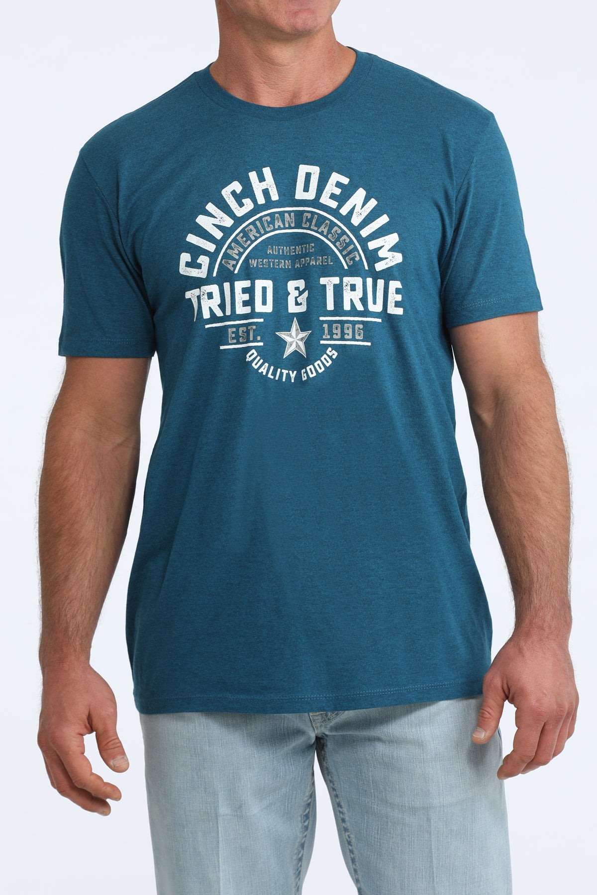 Man wearing a blue t-shirt with 'Cinch Denim' and 'Tried & True' text on a white background