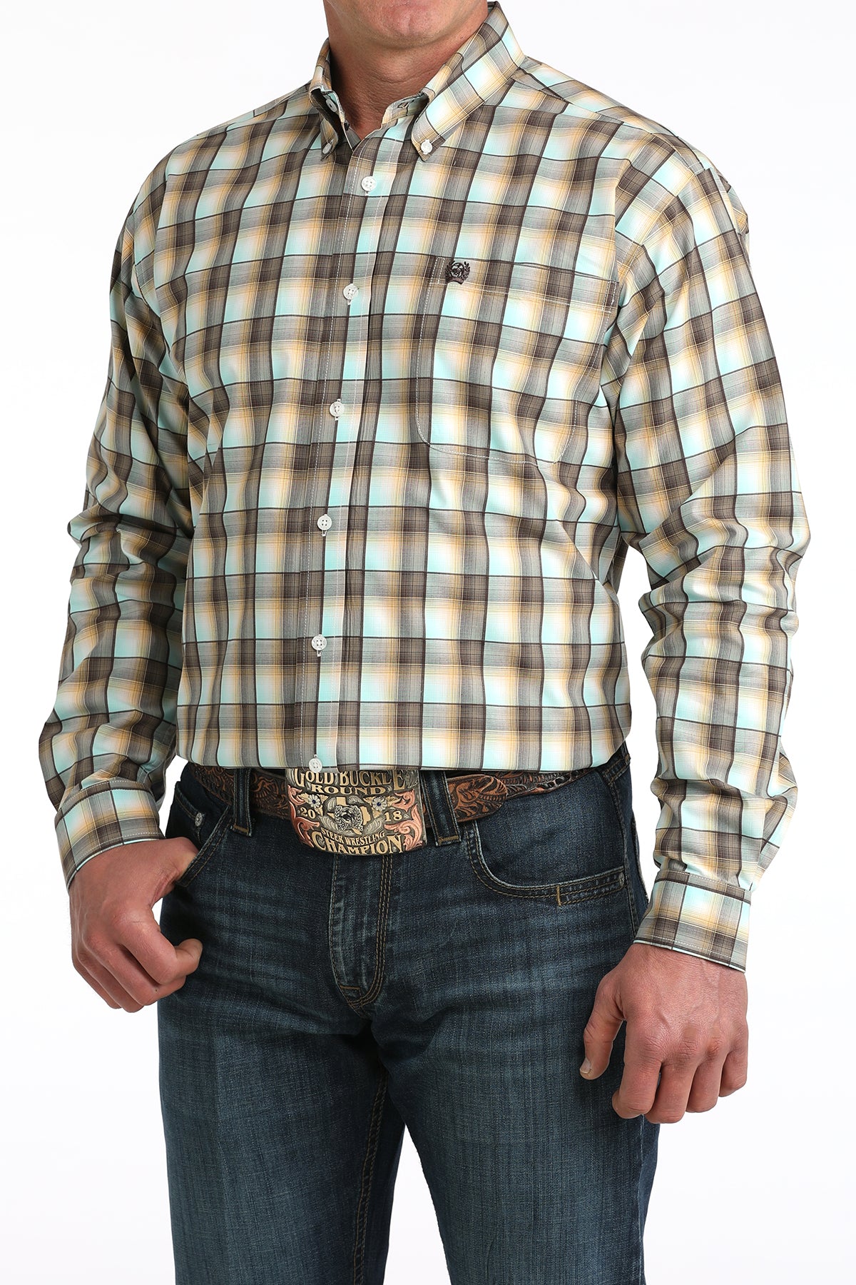 Man wearing a plaid 'Cinch' shirt and jeans with a belt buckle on a white background