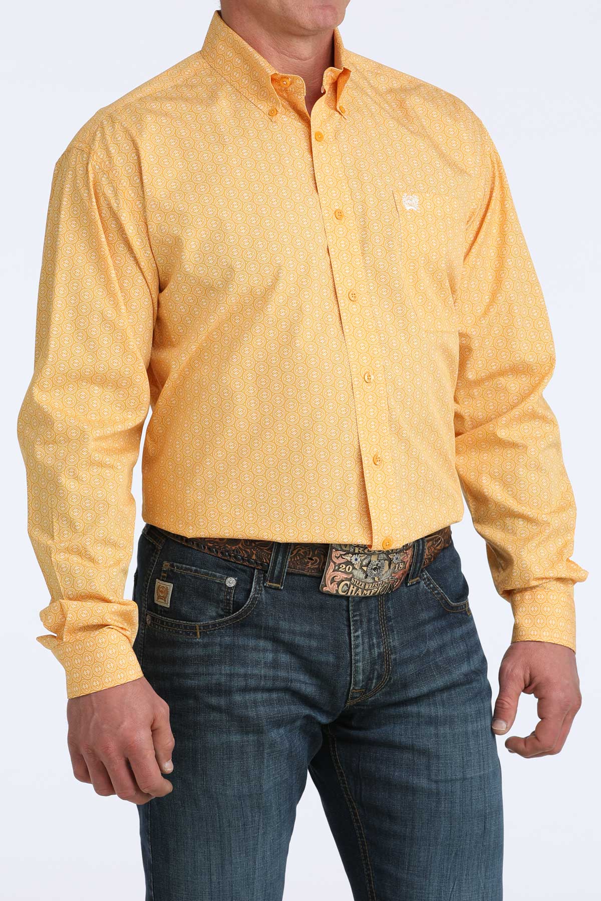 Yellow button-up cinch shirt and blue jeans on a white background