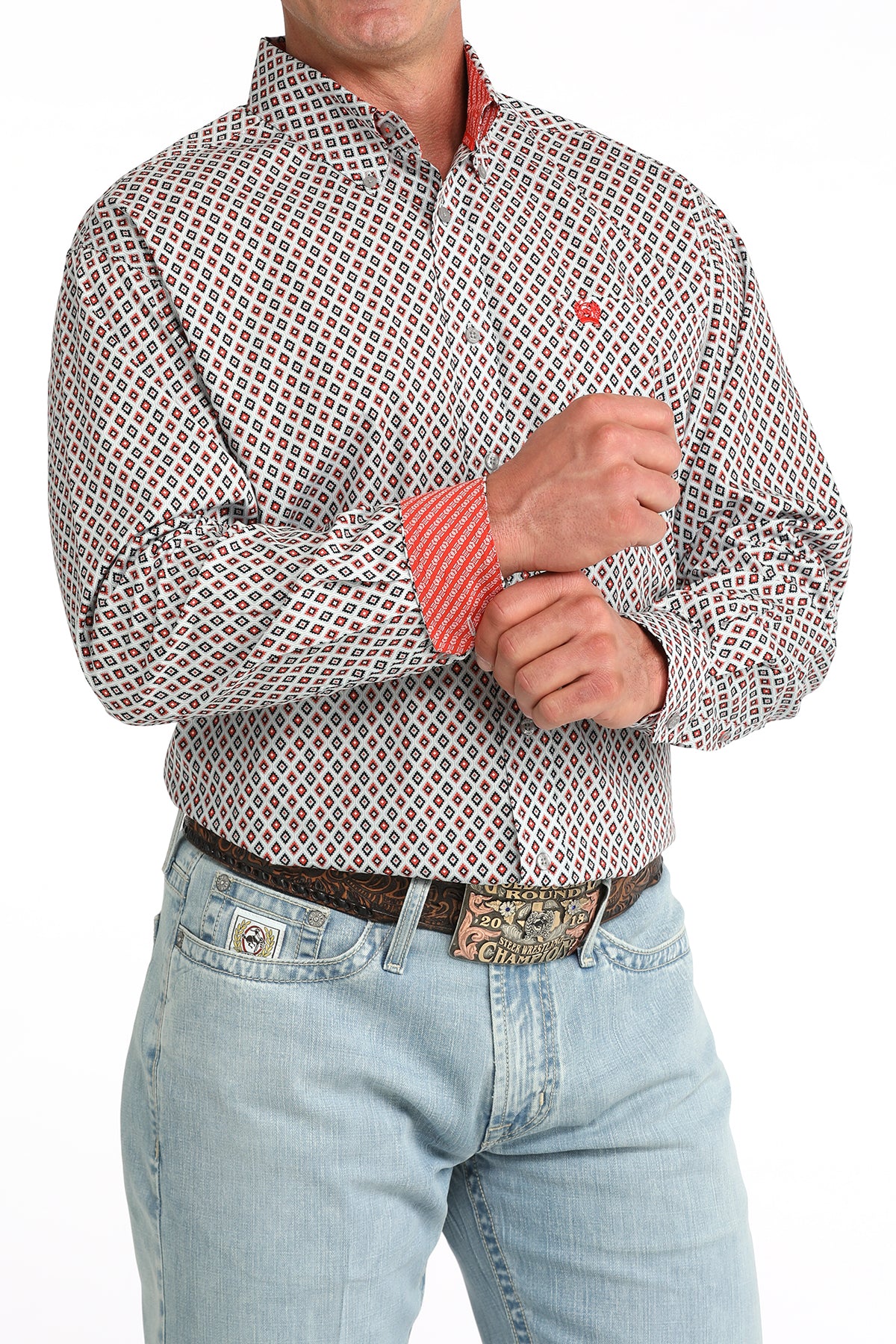 man wearing a grey and red Cinch shirt and blue jeans on a white background