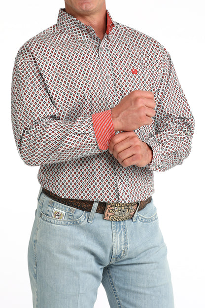 man wearing a grey and red Cinch shirt and blue jeans on a white background