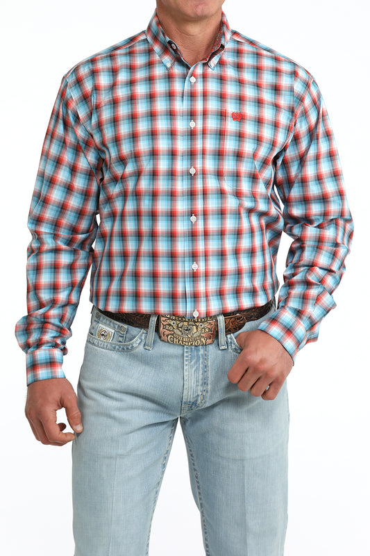Man wearing a Cinch plaid shirt and jeans on a white background