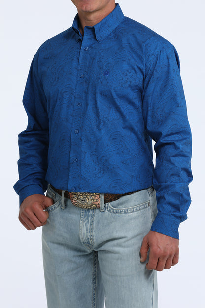 man wearing a blue Cinch shirt and light blue jeans on a white background